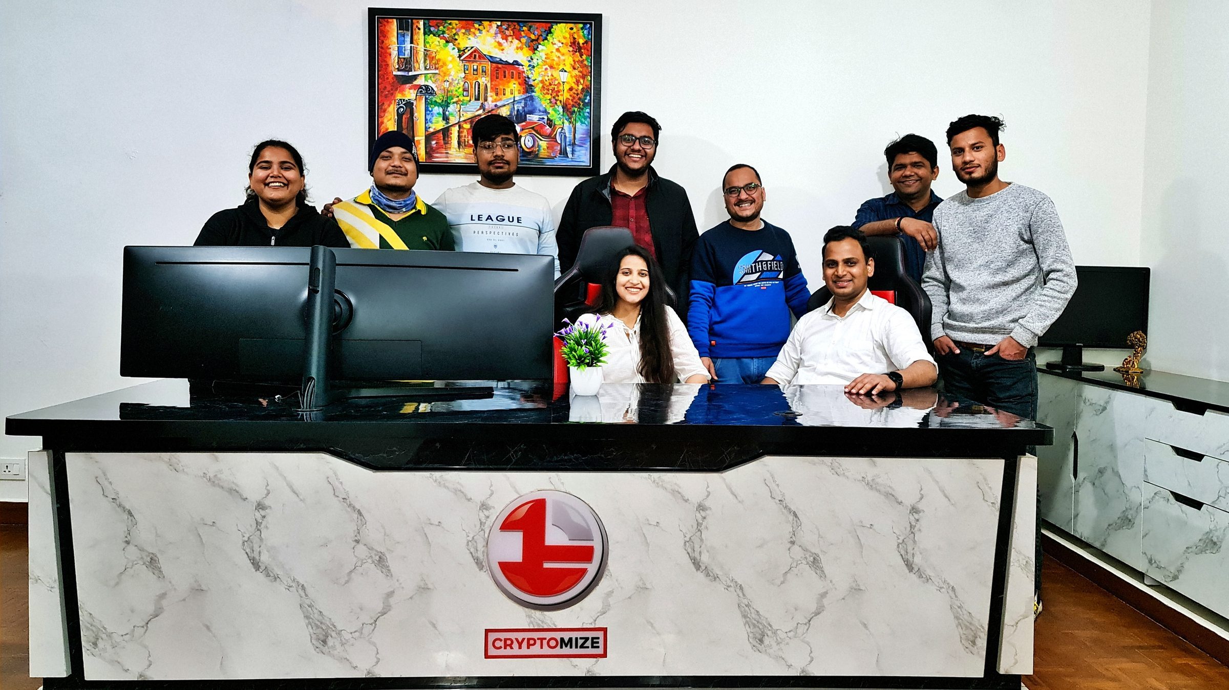 Lithvik Mukesh Sharma is photographed with Dr. Jyoti Kush and the CryptoMize customer support team