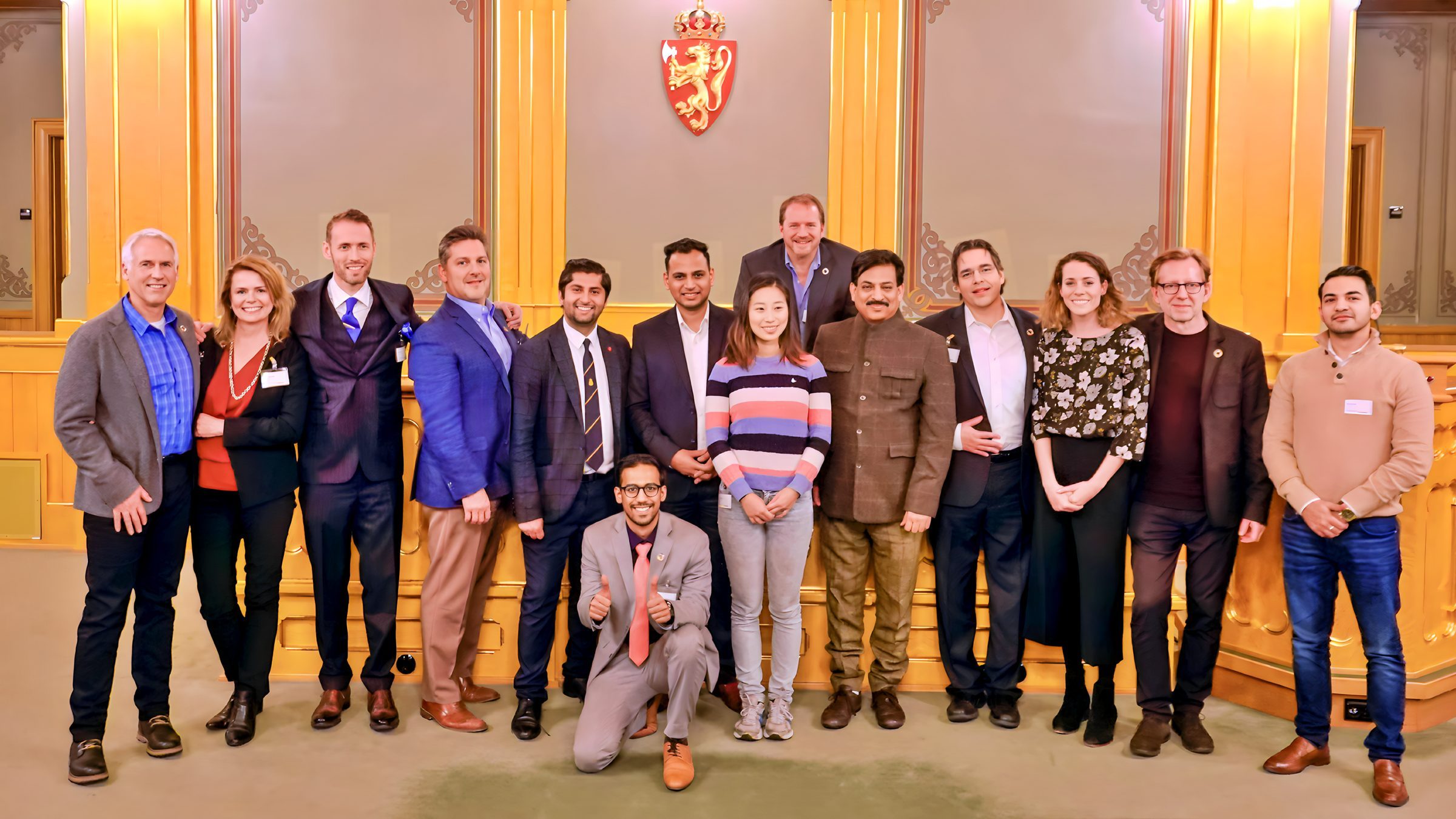 Lithvik Mukesh Sharma is photographed with Vibhav Kant Upadhya, Himanshu Gulati, and international partners including Scott Lewis