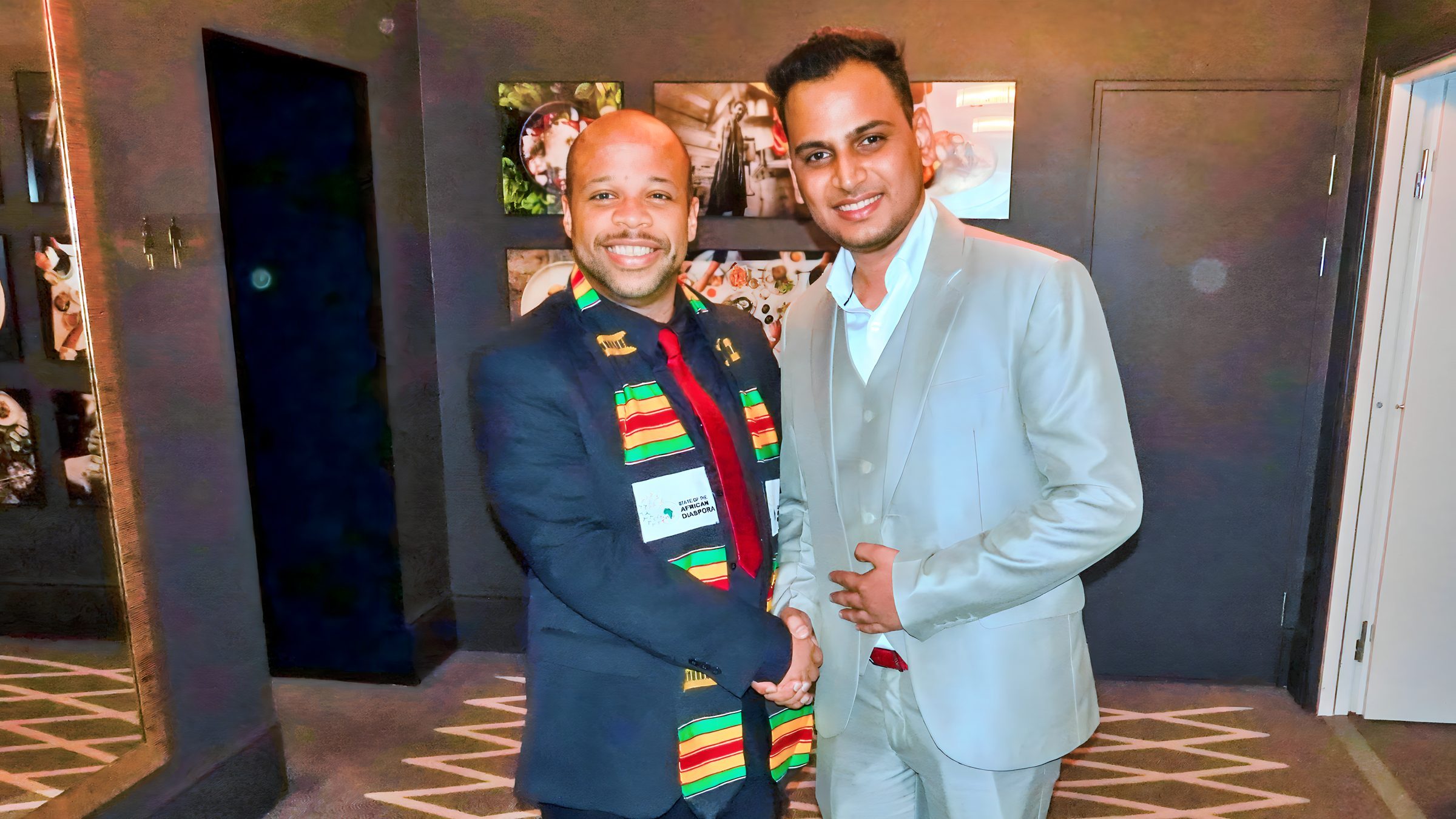 Lithvik Mukesh Sharma shakes hands with His Excellency Dr. Louis-Georges Tin at a diplomatic summit in Uzbekistan. Dr. Louis-Georges Tin