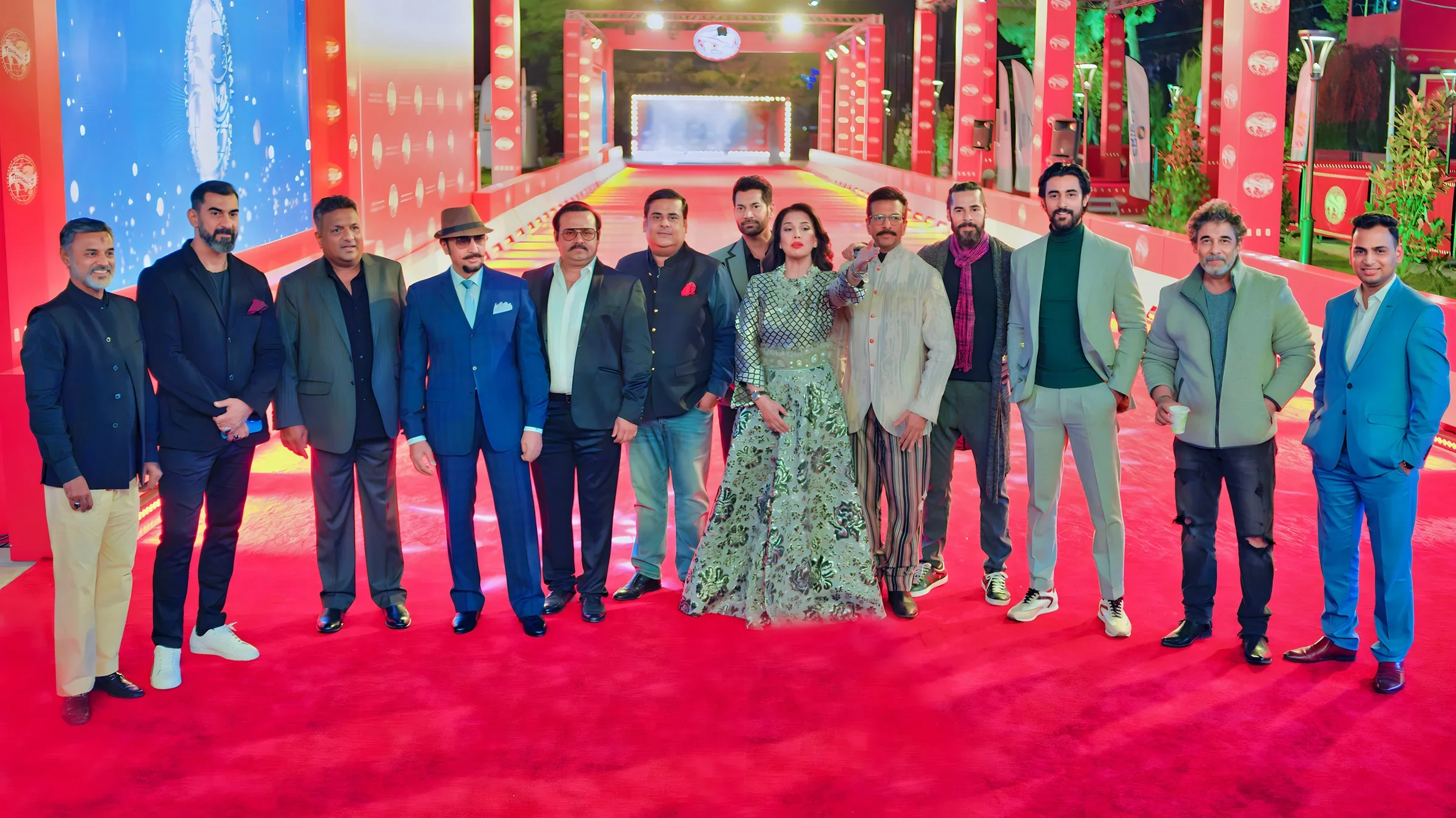 Lithvik Mukesh Sharma is photographed with twelve members of the Indian film delegation at the Tashkent Film Festival.