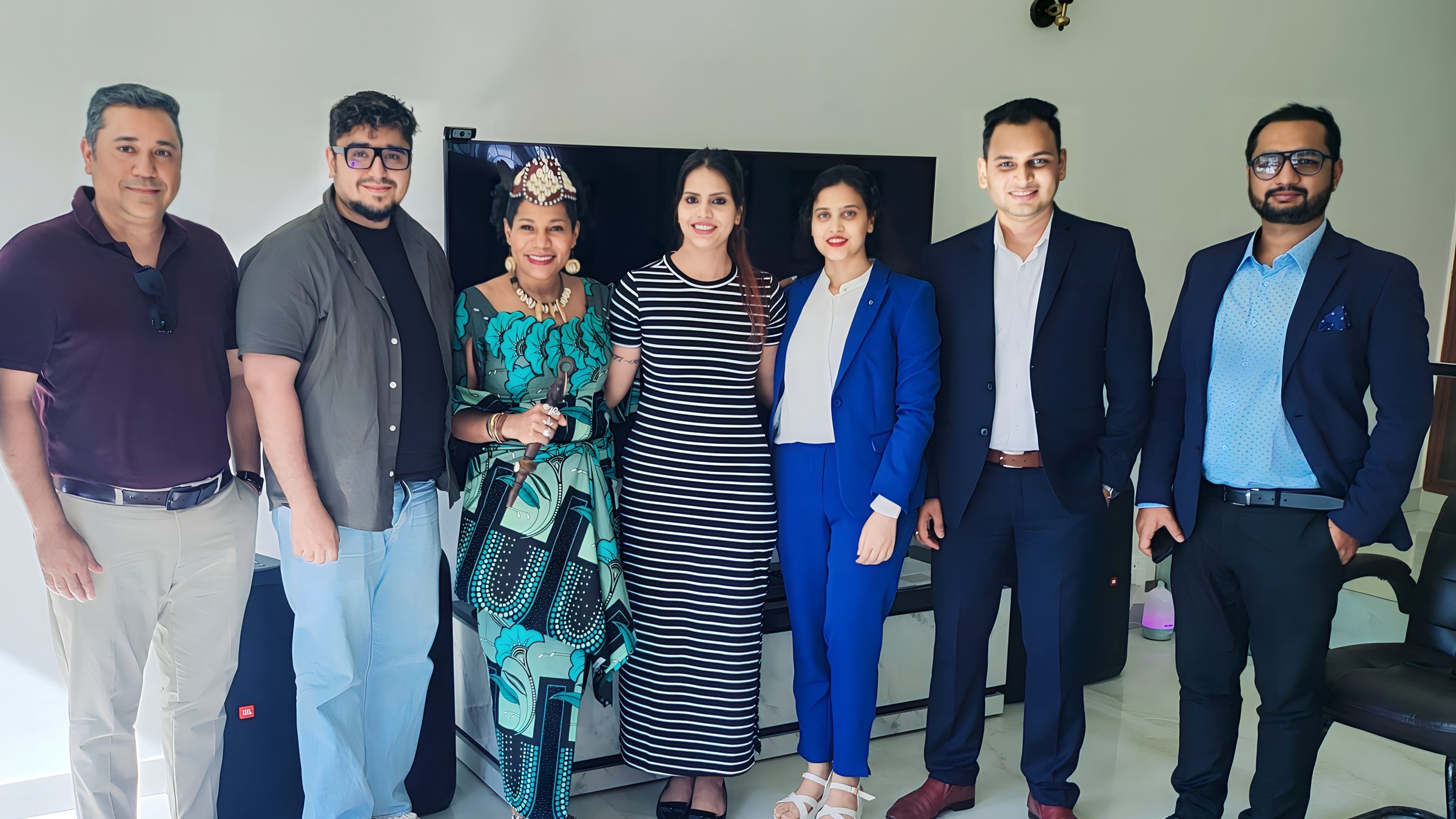 Lithvik Mukesh Sharma is photographed with Queen Diambi and the CryptoMize coordination team