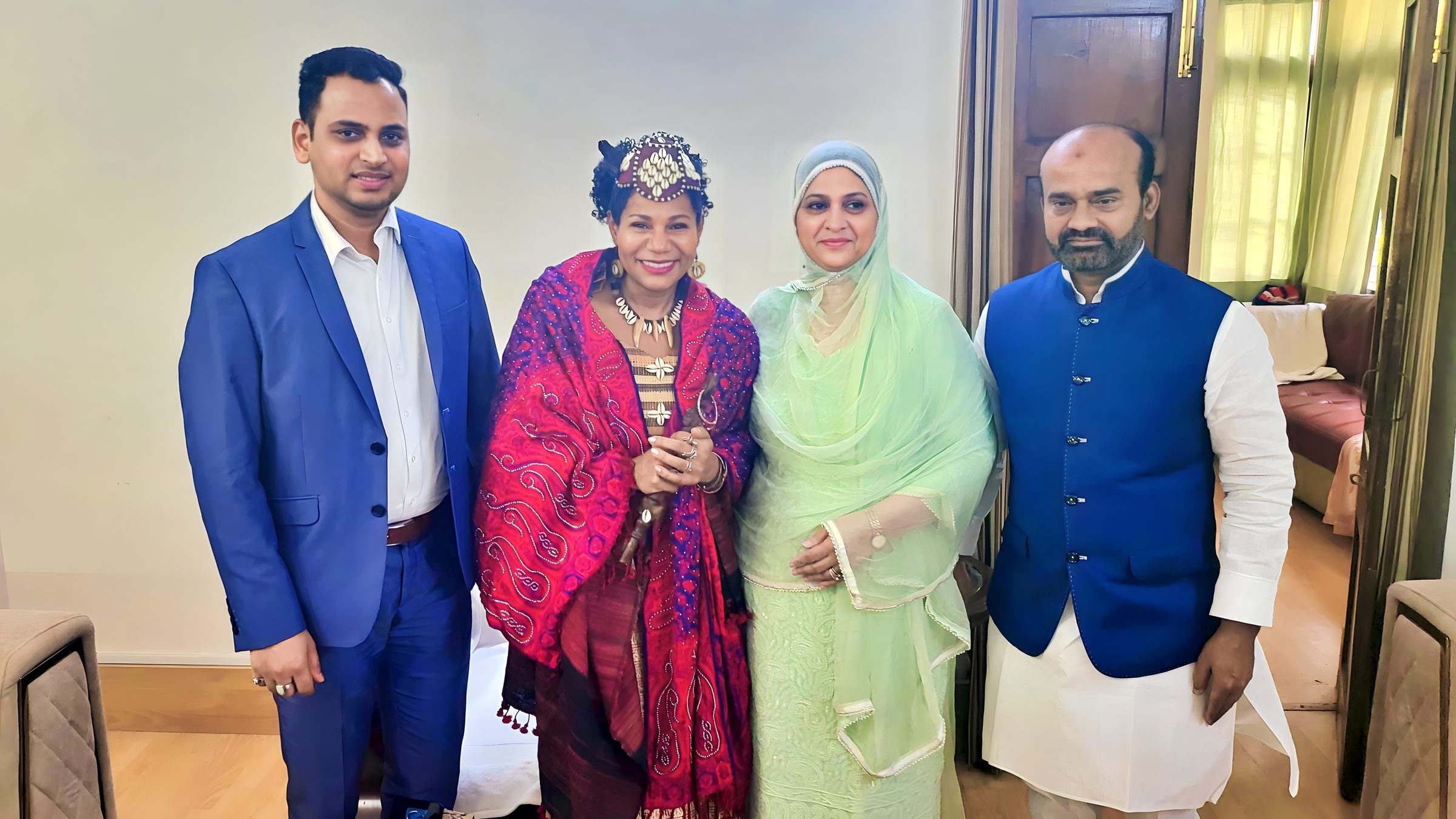 Lithvik Mukesh Sharma is photographed with Queen Diambi and political leaders at a hosted gathering
