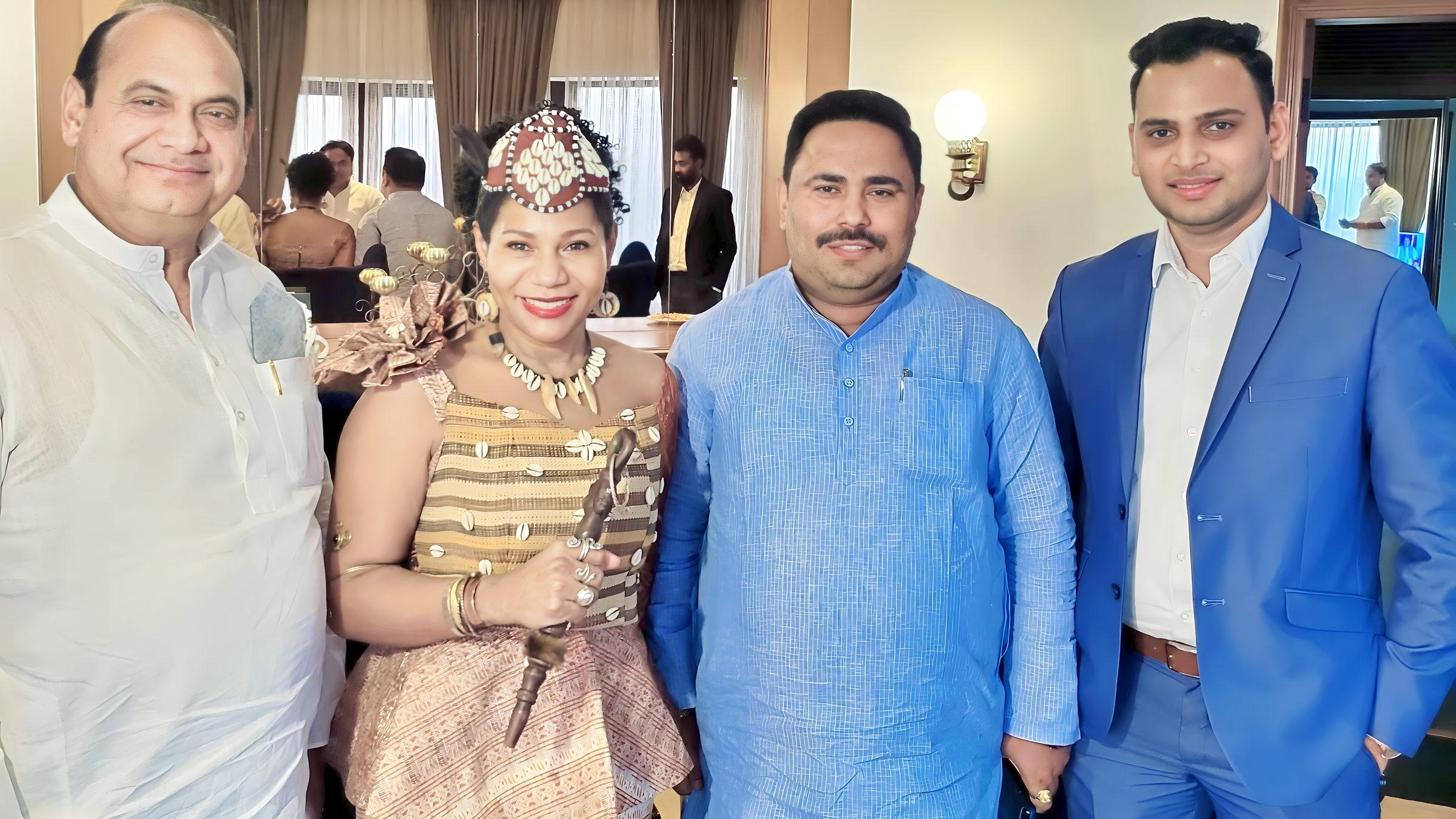 Lithvik Mukesh Sharma is photographed with Queen Diambi and senior party leaders at a hosted gathering