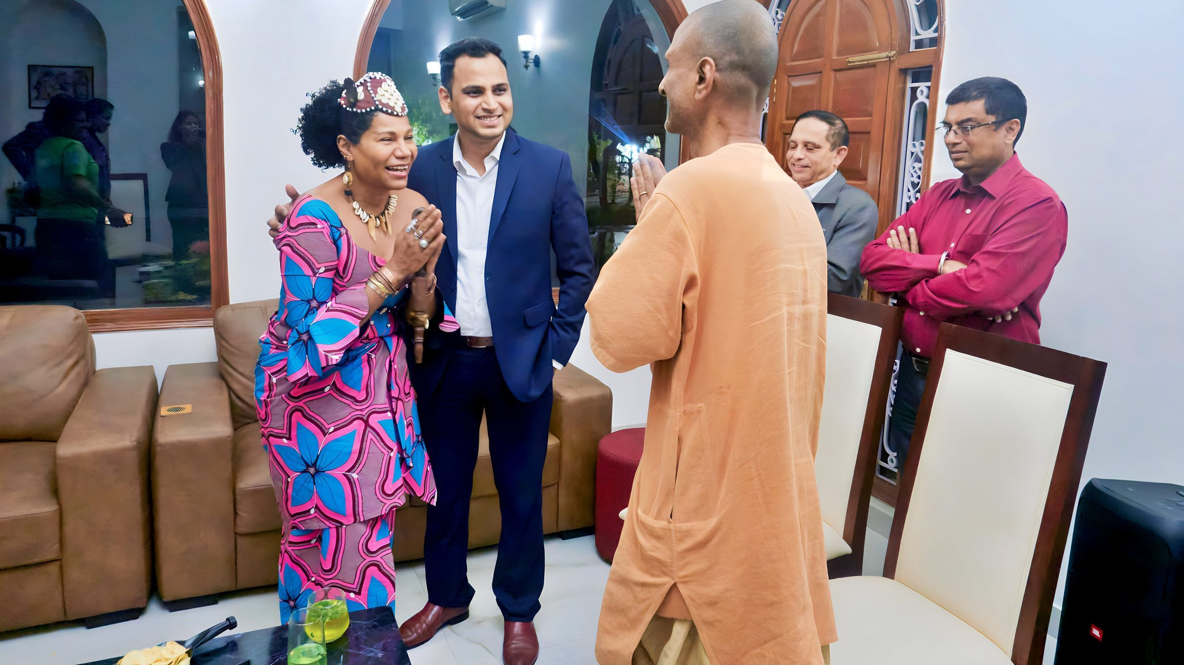 Lithvik Mukesh Sharma is photographed alongside Queen Diambi. The enclosed residential gathering shows Lithvik Mukesh Sharma