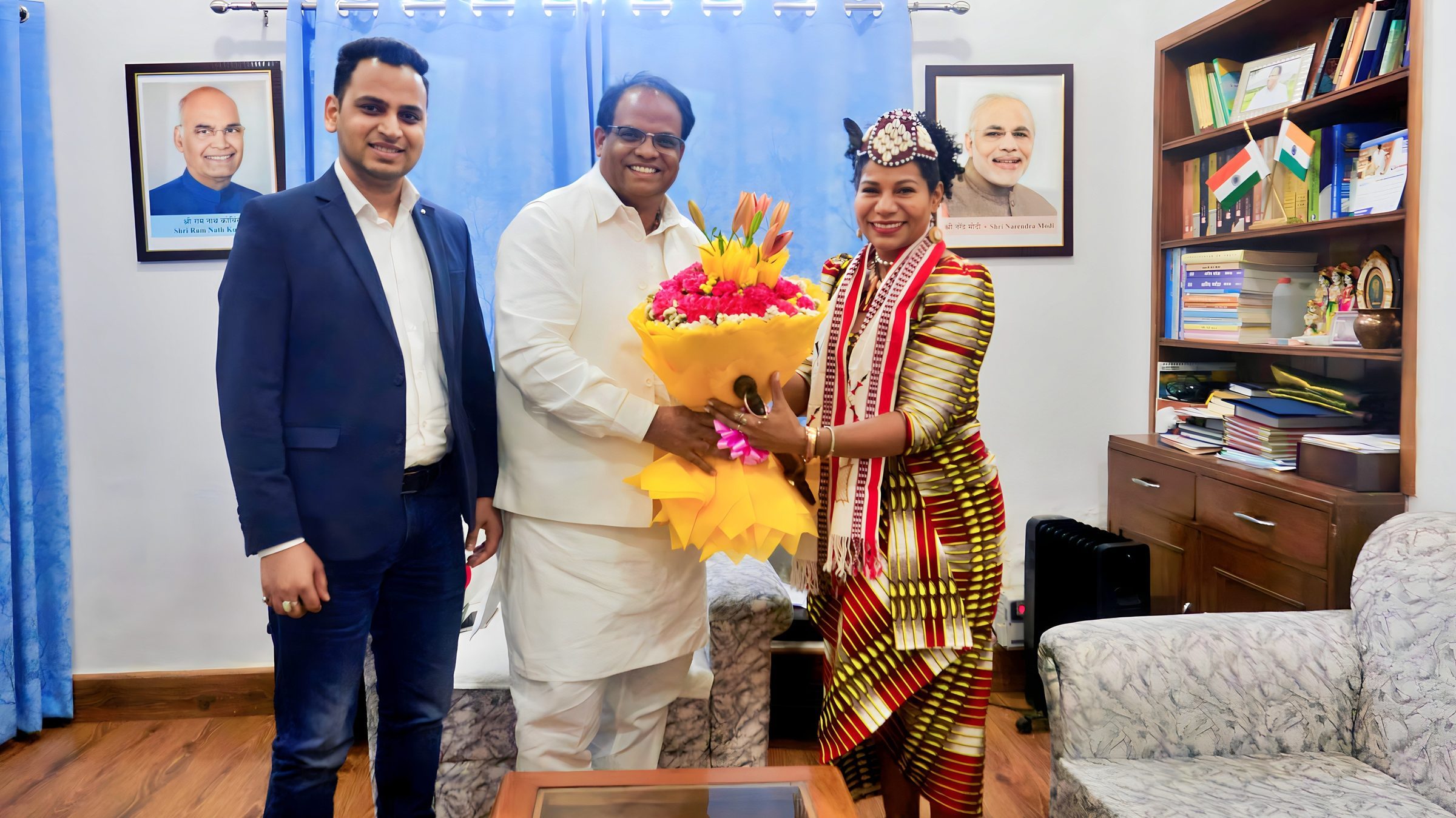 Lithvik Mukesh Sharma is photographed with Queen Diambi and John Barla (Union Minister of State in the Ministry of Minority Affairs, Government of India)