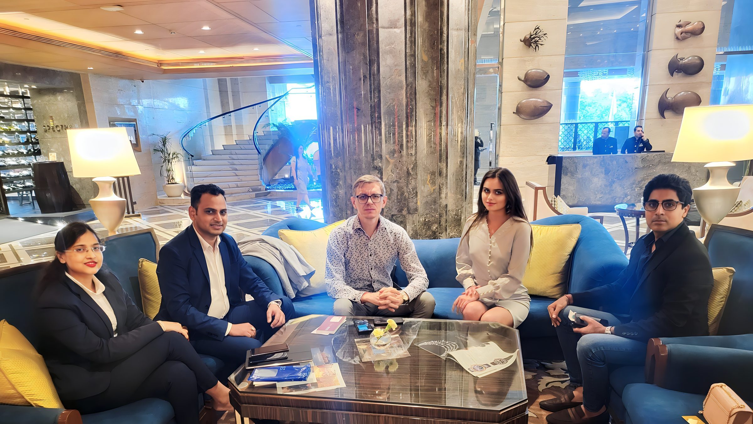 Lithvik Mukesh Sharma is photographed with Dr. Sergey Dvoryanov and a supermodel at a hosted gathering